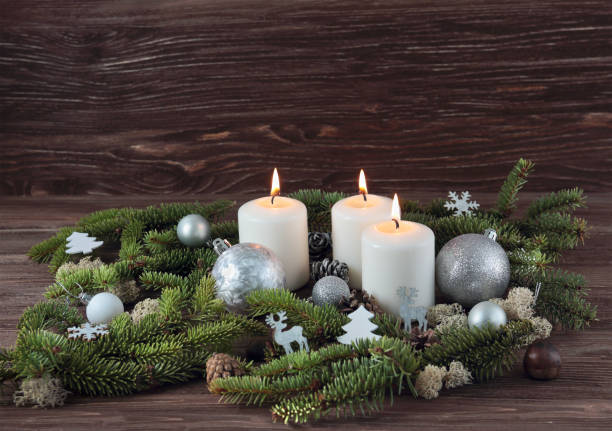 istock Candles, spruce branches, Christmas decorations on a wooden background 870214934