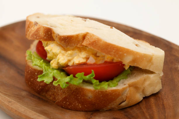 istock Sandwich with egg tomato lettuce isolated on white background 870217304