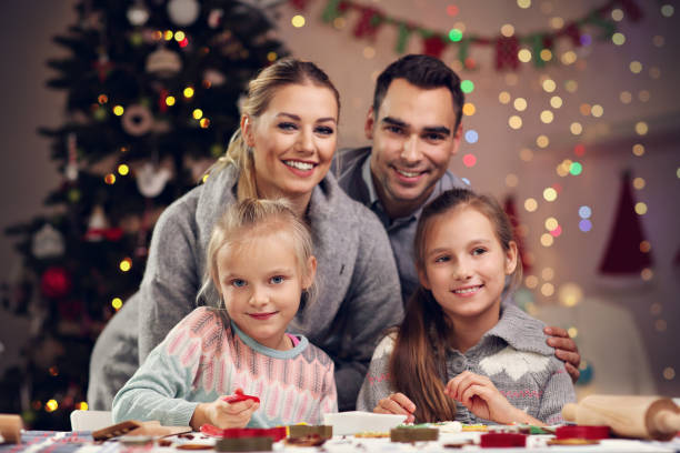 istock Joyful family preparing Christmas biscuits 870218002