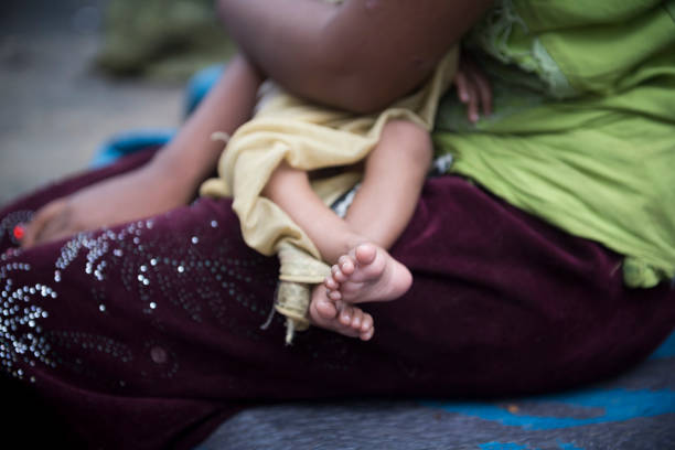 Newly arrived Rohingya Muslims from Myanmar, including this baby, wait to complete the registration process at Kutupalong refugee camp in Bangladesh. They are among the 600,000 Rohingya who fled Myanmar in the two months since August 25. (October 29, 2017)