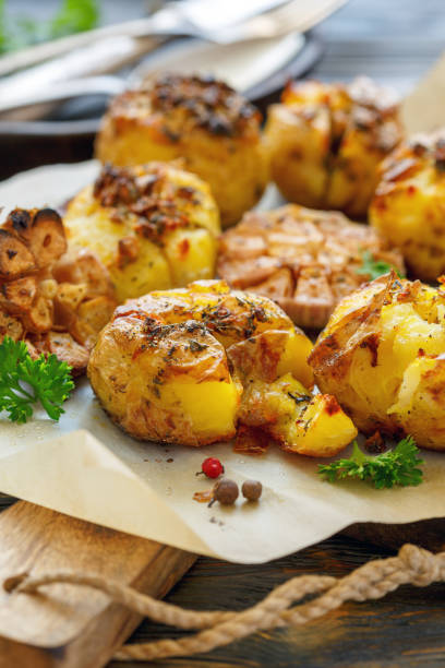 istock Potatoes baked in their skins with spices. 870226186