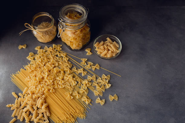 istock Composition of uncooked italian pasta. 870233286