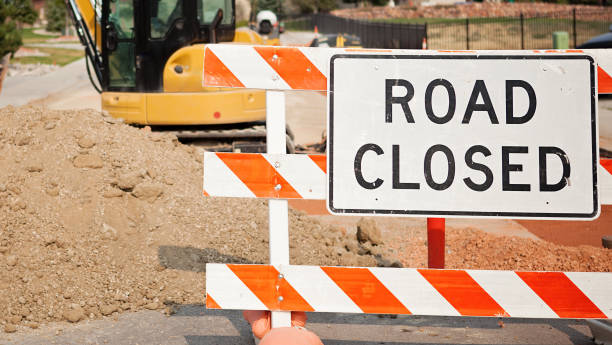 istock Road Closed Sign and Tractor -  Road Construction 870234422