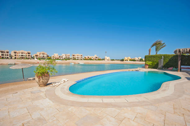 istock Swimming pool at at luxury tropical holiday villa 870241390