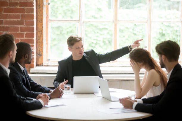 istock Strict boss telling upset employee to leave room during briefing. 870244278