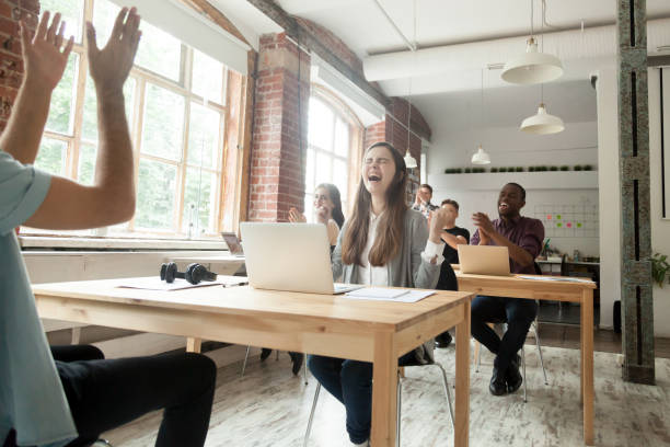 istock Coworkers celebrating tremendous achievement in shared office. 870244370