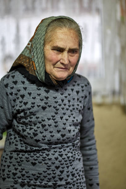 istock Old farmer woman indoor 870247342