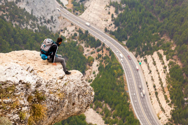 istock Mountain Man Success Concept on high Rock 870251176
