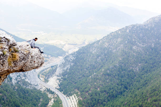 istock Mountain Man Success Concept on high Rock 870251184