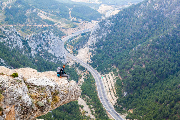 istock Mountain Man Success Concept on high Rock 870251190