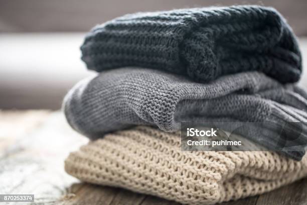 Stack Of Cozy Knitted Sweaters Stock Photo - Download Image Now - Cardigan Sweater, Sweater, Wool