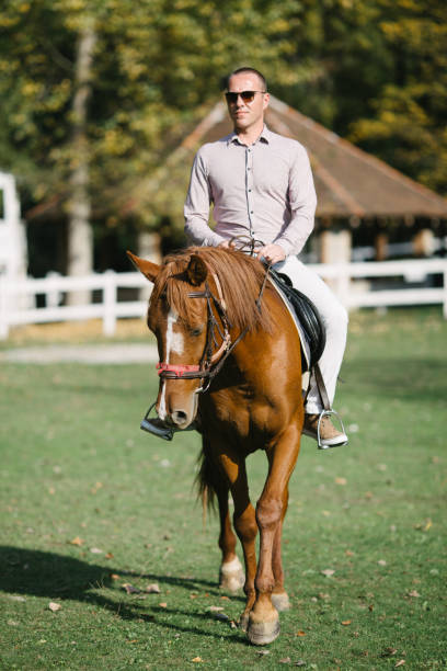 istock Man and horse 870253890
