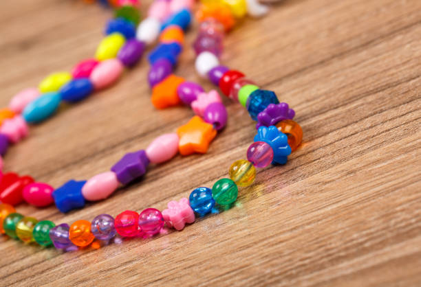 istock Beaded stacked on a wooden table 870255424