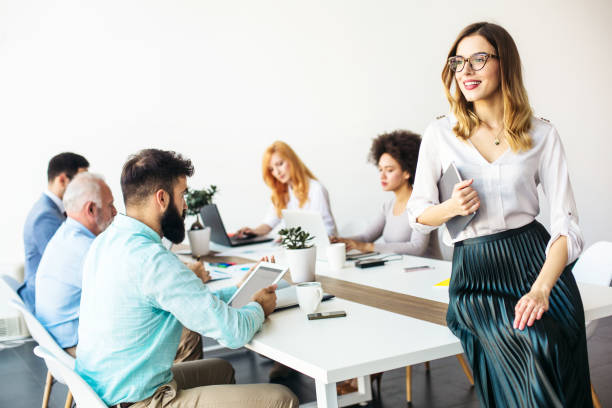 istock Young businesswoman working in modern office on a digital tablet 870258558