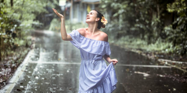 istock girl happy rain 870261066