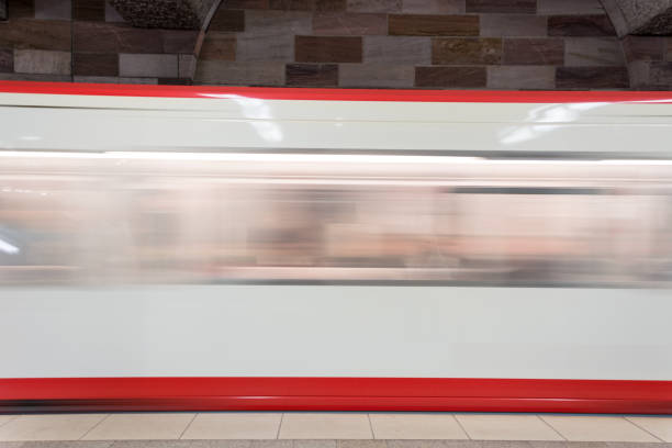 istock Moving white and red subway in the underground going past from the side 870261212