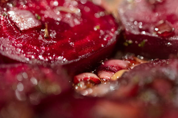istock Caramelized beetroot background, with shallots and green onions. 870261254