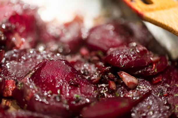 istock Caramelized beetroot background, with shallots and green onions. 870261260