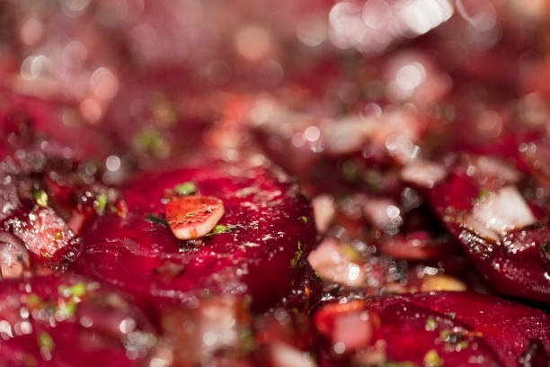 istock Caramelized beetroot background, with shallots and green onions. 870261264