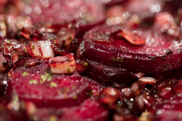 Caramelized beetroot background, with shallots and green onions. stock photo