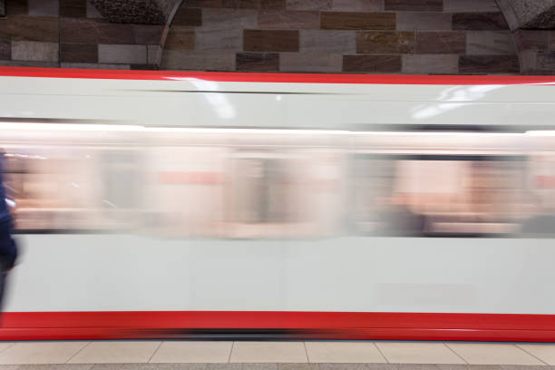 istock Moving white and red subway in the underground going past from the side 870261278