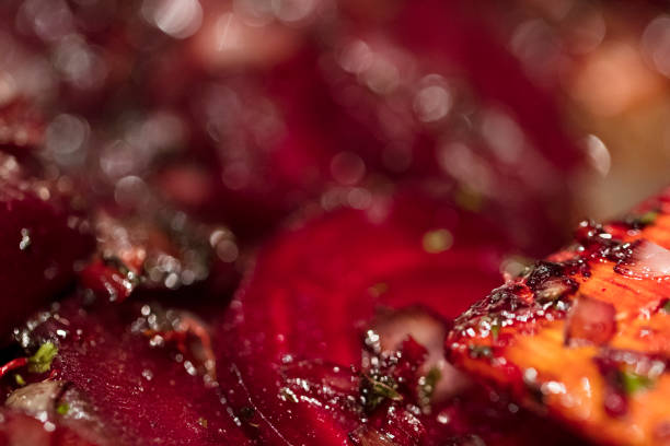 istock Caramelized beetroot background, with shallots and green onions. 870261290