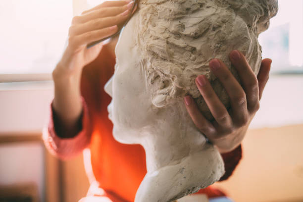 Artist is working in an atelier.