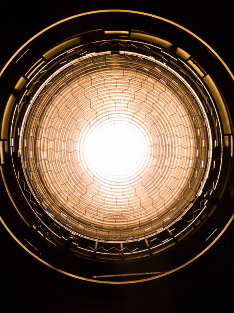 Film light 10k Closeup A closeup of the fresnel lens on a 10 Film lamp head with the safety mesh. quesnel stock pictures, royalty-free photos & images