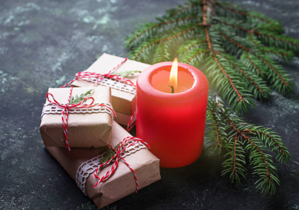 istock Christmas background with gift boxes and candle 870281288