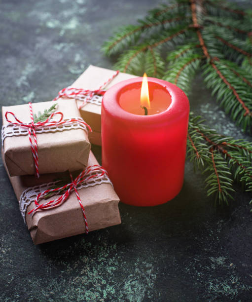 istock Christmas background with gift boxes and candle 870281336