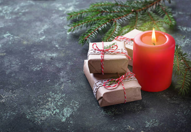 istock Christmas background with gift boxes and candle 870281394