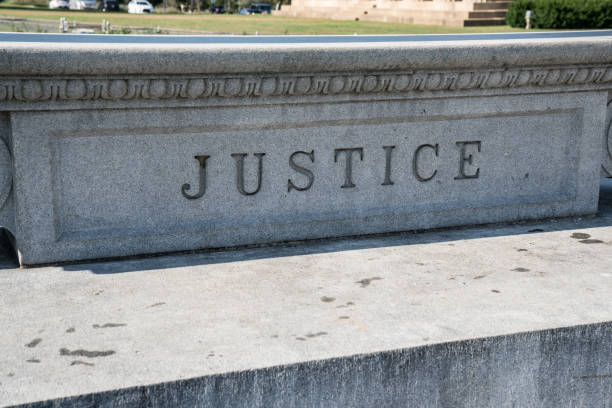istock Justice Sign Carved in Stone 870287154