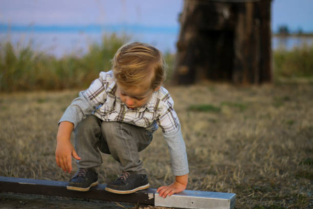 istock Spirited Child on the Beach at Sunset 870287298