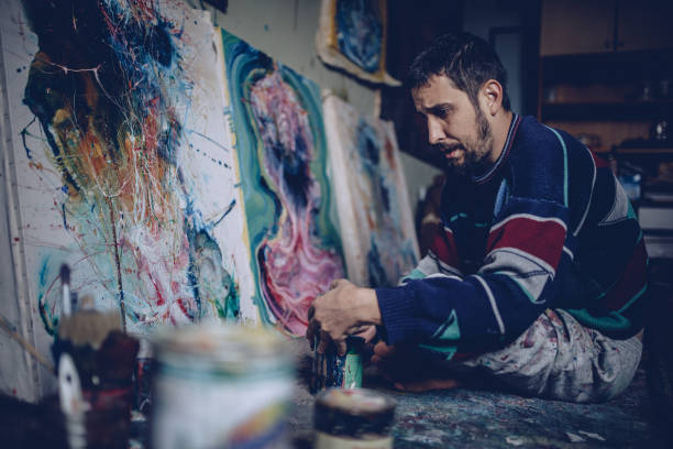 istock Artist working on painting 870296378