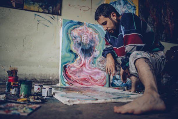 istock Male Painter Working On Painting In Studio 870298526