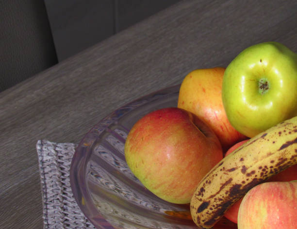 istock Fruit centerpiece on grey furniture 870298736