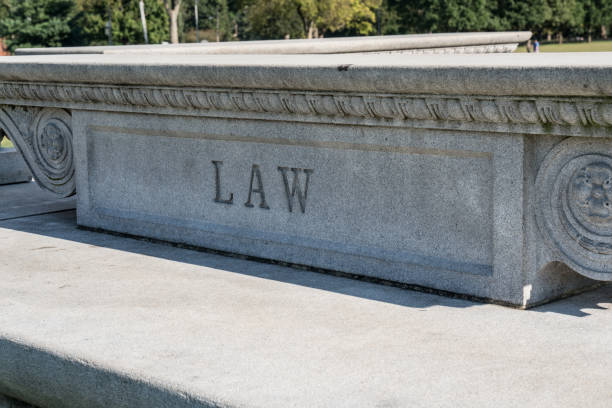 istock Law Sign Carved in Stone 870304100