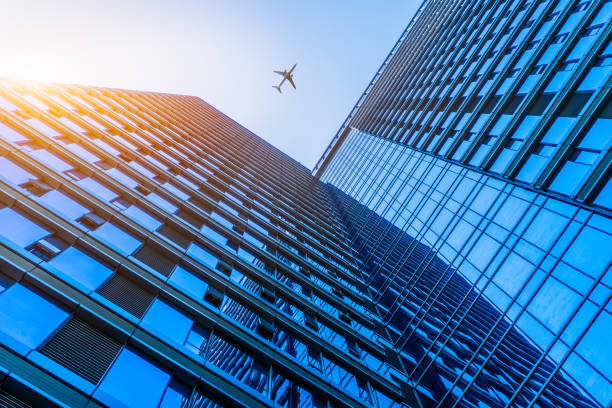 istock Plane flying over the skyscrapers 870310280