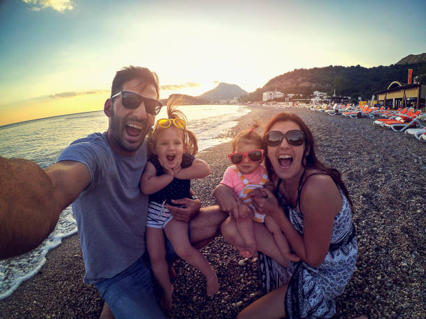 istock Crazy selfie family with sunglasses on the beach 870326844