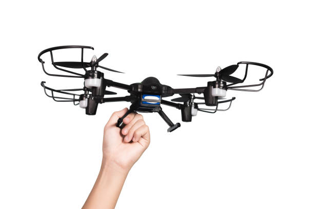 istock Kid hand holding drone or guadcopter, isolated on white background with clipping path. 870330106