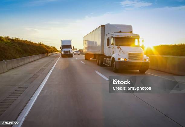 18 Wheeler Trucks On The Road Stock Photo - Download Image Now - Truck, Freight Transportation, Semi-Truck