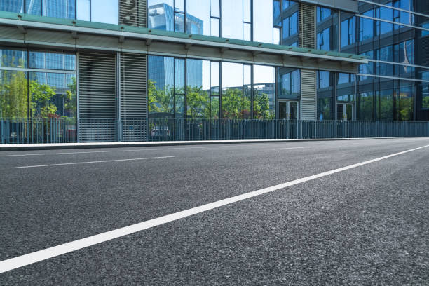 istock Empty road front of modern buildings 870342138