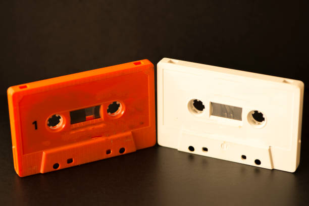 istock Old cassettes on a background of a black color 870342148
