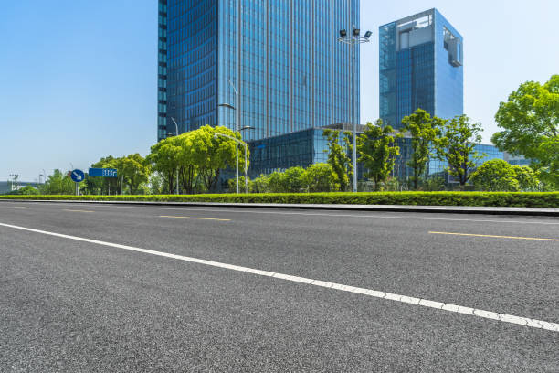 istock Clean asphalt road with city skyline background 870351864