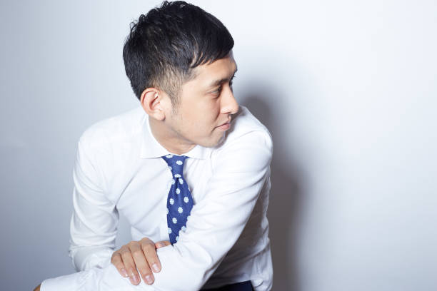 Young Japanese man looking away
