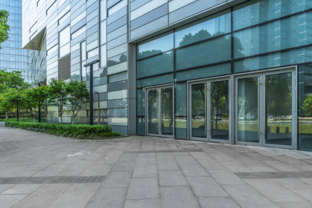 istock Empty brick road nearby office building 870358876