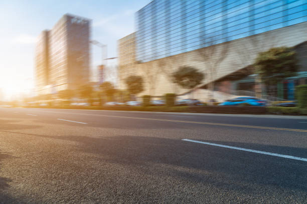 istock Empty road front of the modern office building 870364658