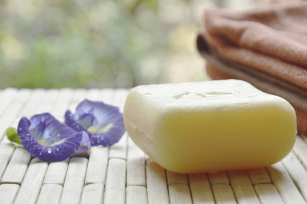 istock soap and towel with blue pea on bamboo mat 870367810
