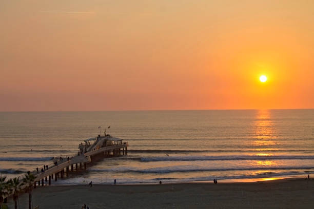 istock Lido di Camaiore pier at sunset 870391996
