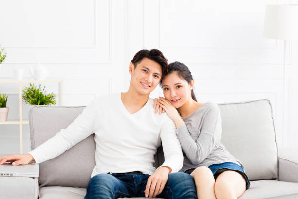 istock Young happy couple hugging and smiling 870392042